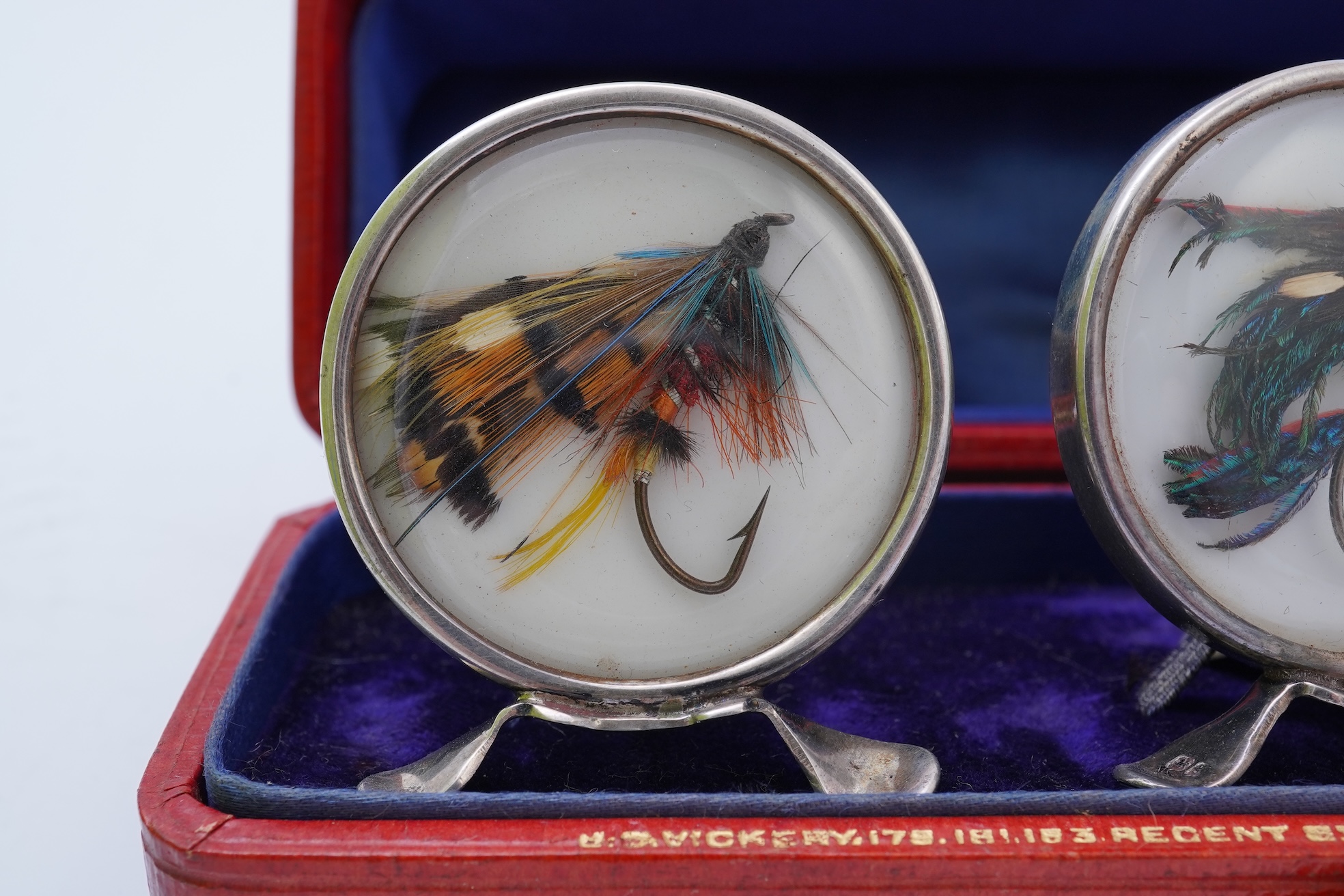 A set of four early 20th century silver mounted fishing related novelty menu holders, by Grey & Co, housed in a red leather case with gilt initials RV